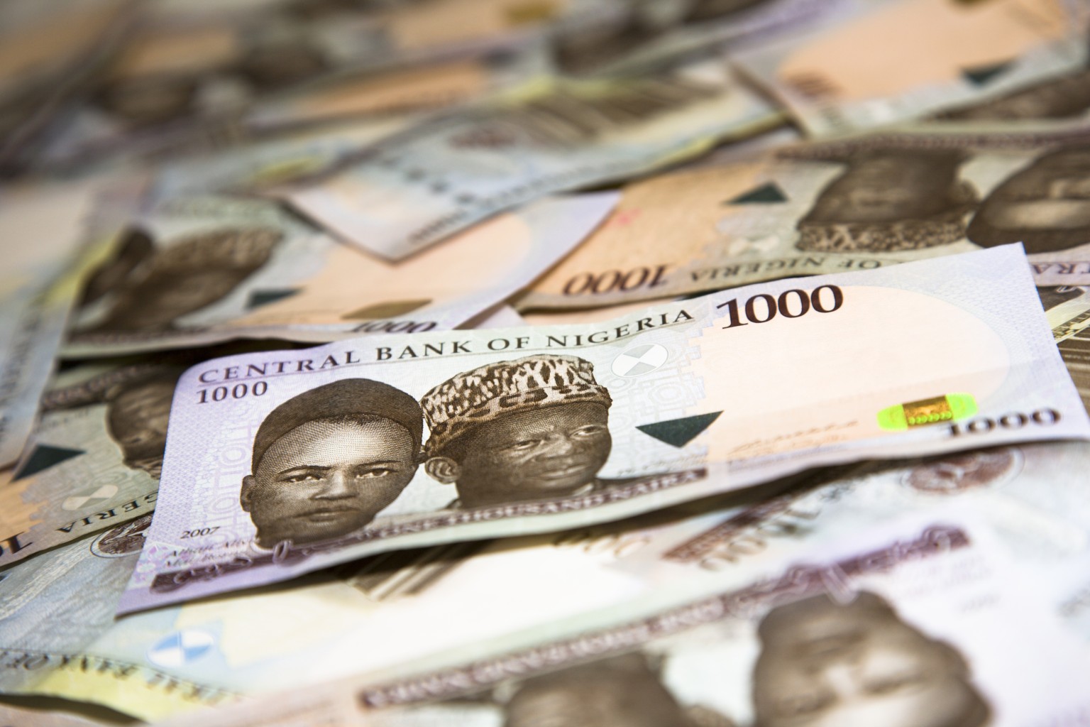Naira firms after Buhari rejects devaluation