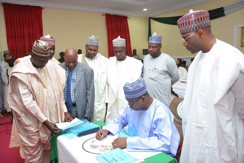 Governor Ibrahim Geidam of Yobe State signing into law the 2016 Finance and Appropriations Bills passed by the State Assembly.