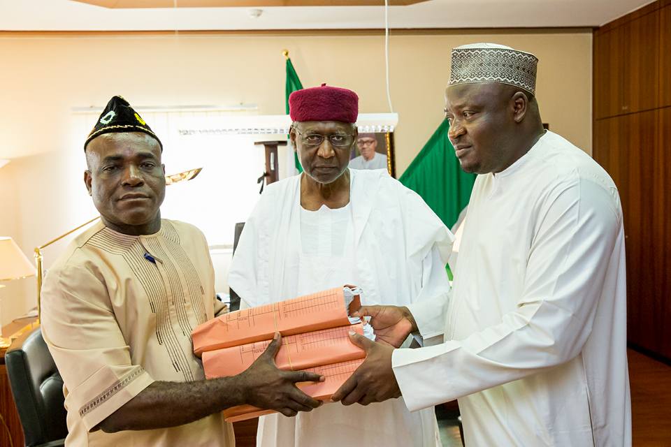 Chief of Staff to President Muhammadu Buhari, Alhaji Abba Kyari receiving 2016 budget from Senior Special Assistants to President on National Assembly Matters, Senator Eta Enang and Honourable Kawu Ismaila at the State House in Abuja on Thursday, April 7, 2016.
