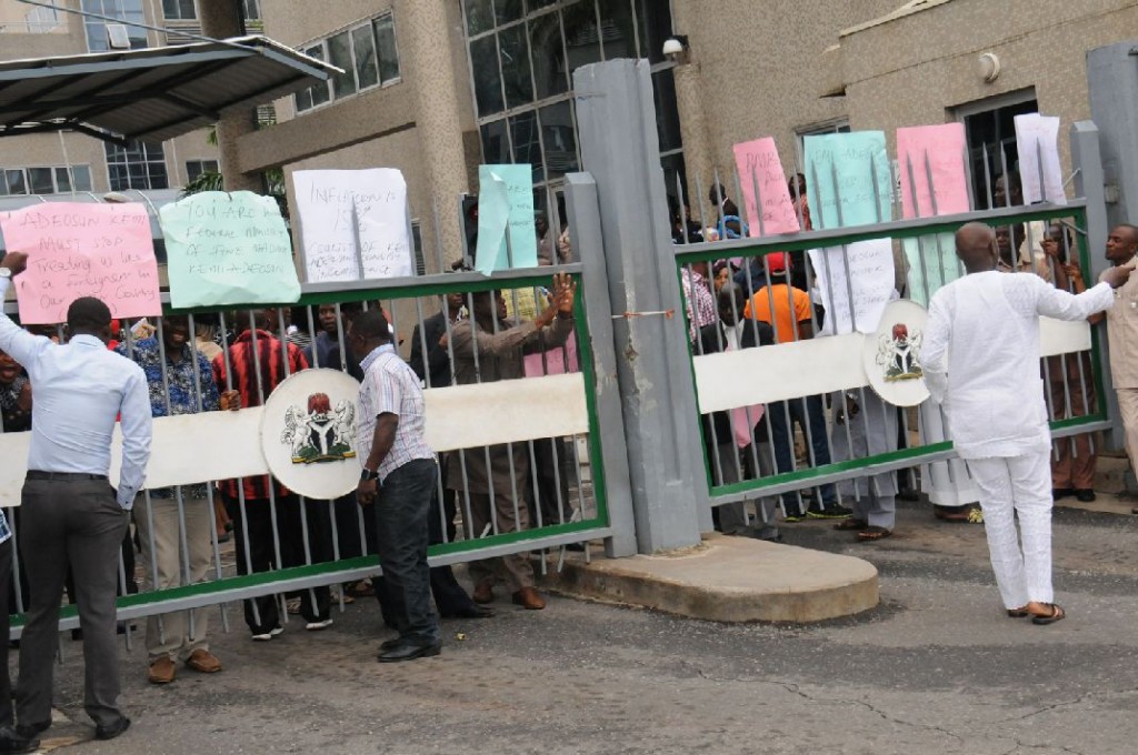 Protesting staff lock out finance minister from office