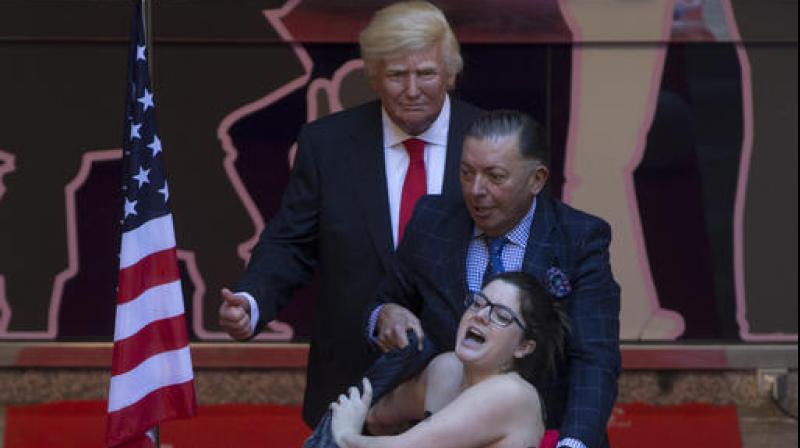 Naked protester grabs ‘Trump’s crotch