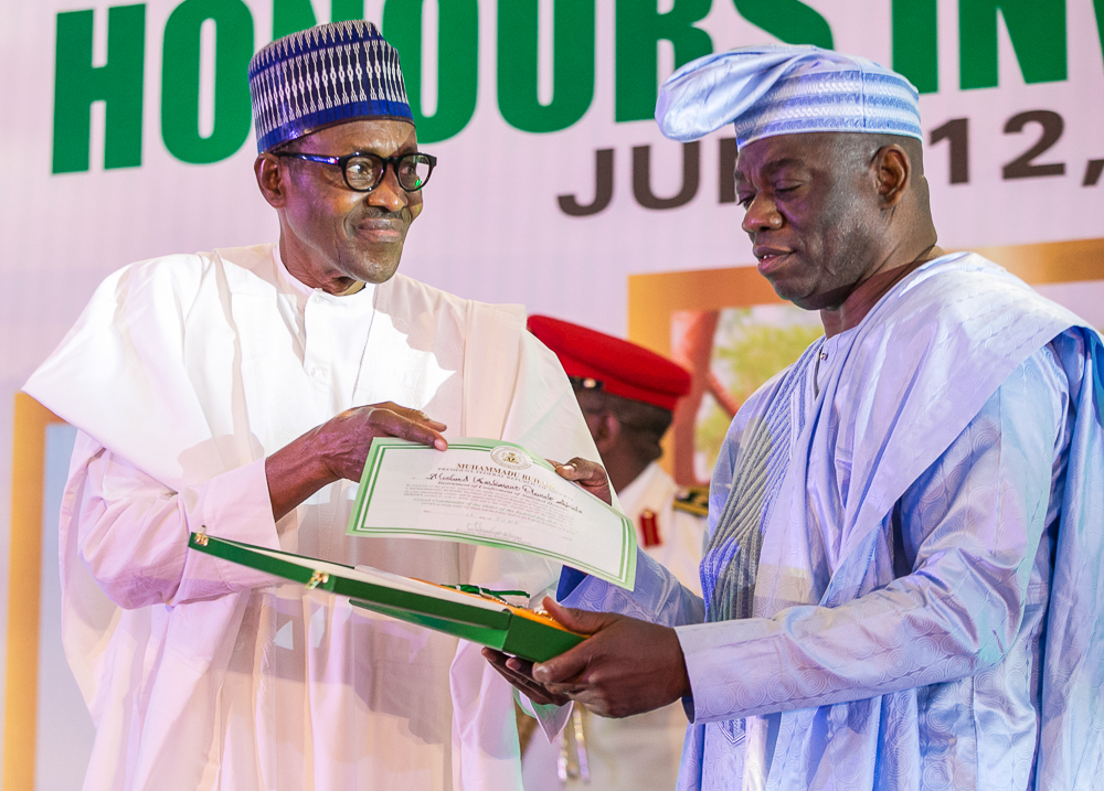 President Muhammadu Buhari declared June 12 Democracy Day and honoured late Chief M.K.O Abiola with national honours award of the Grand Commander of the Order of the Federal Republic (GCFR). His running mate, Ambassador Babagana Kingibe, and late human rights activist and lawyer, Chief Abdul Ganiyu Fawehinmi, with Grand Commander of the Order of the Niger (GCON), at the Presidential Villa, Abuja. PHOTO: State House