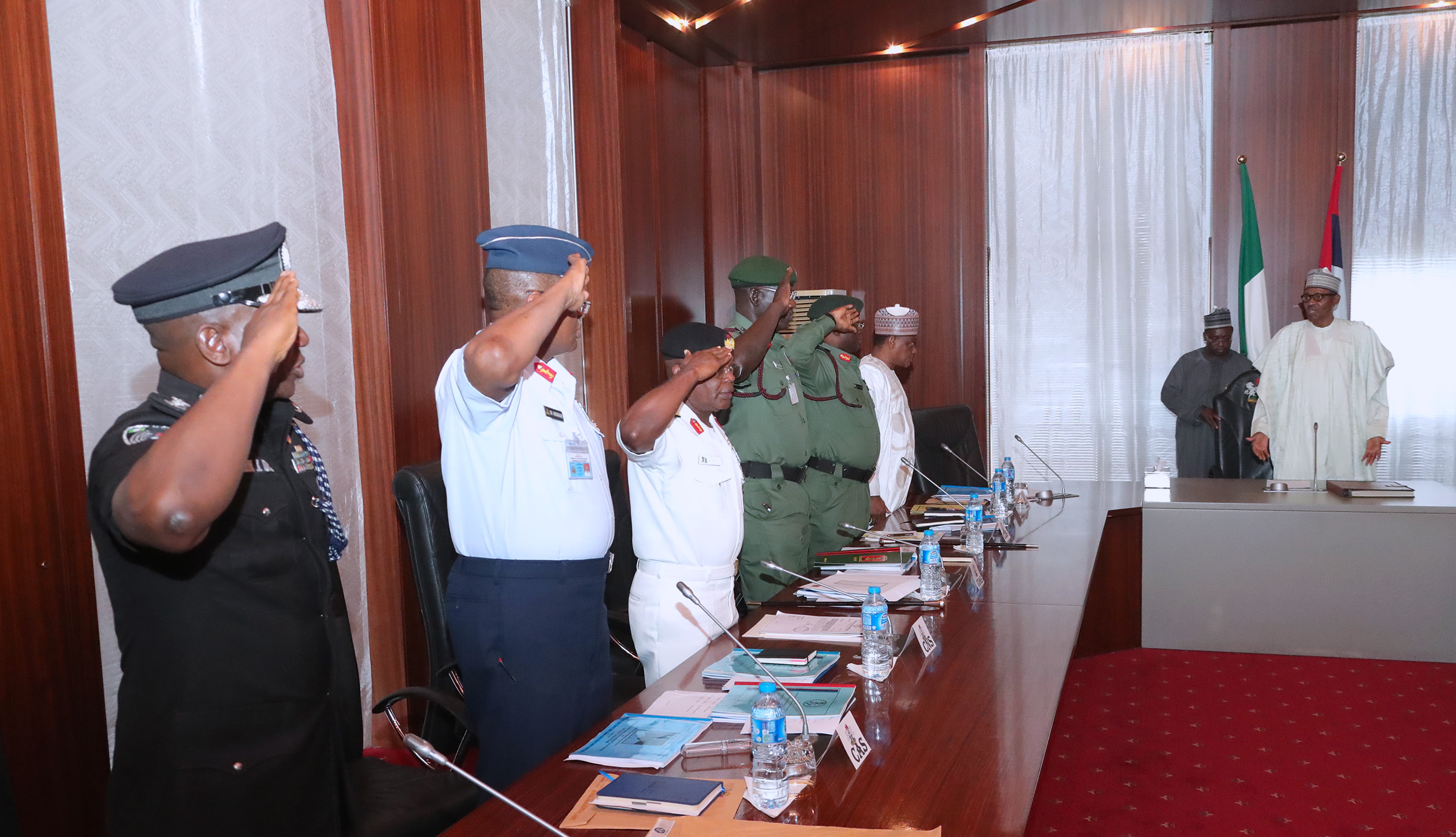 President Muhammadu Buhari meets service chiefs and heads of security agencies at the State House in Abuja.