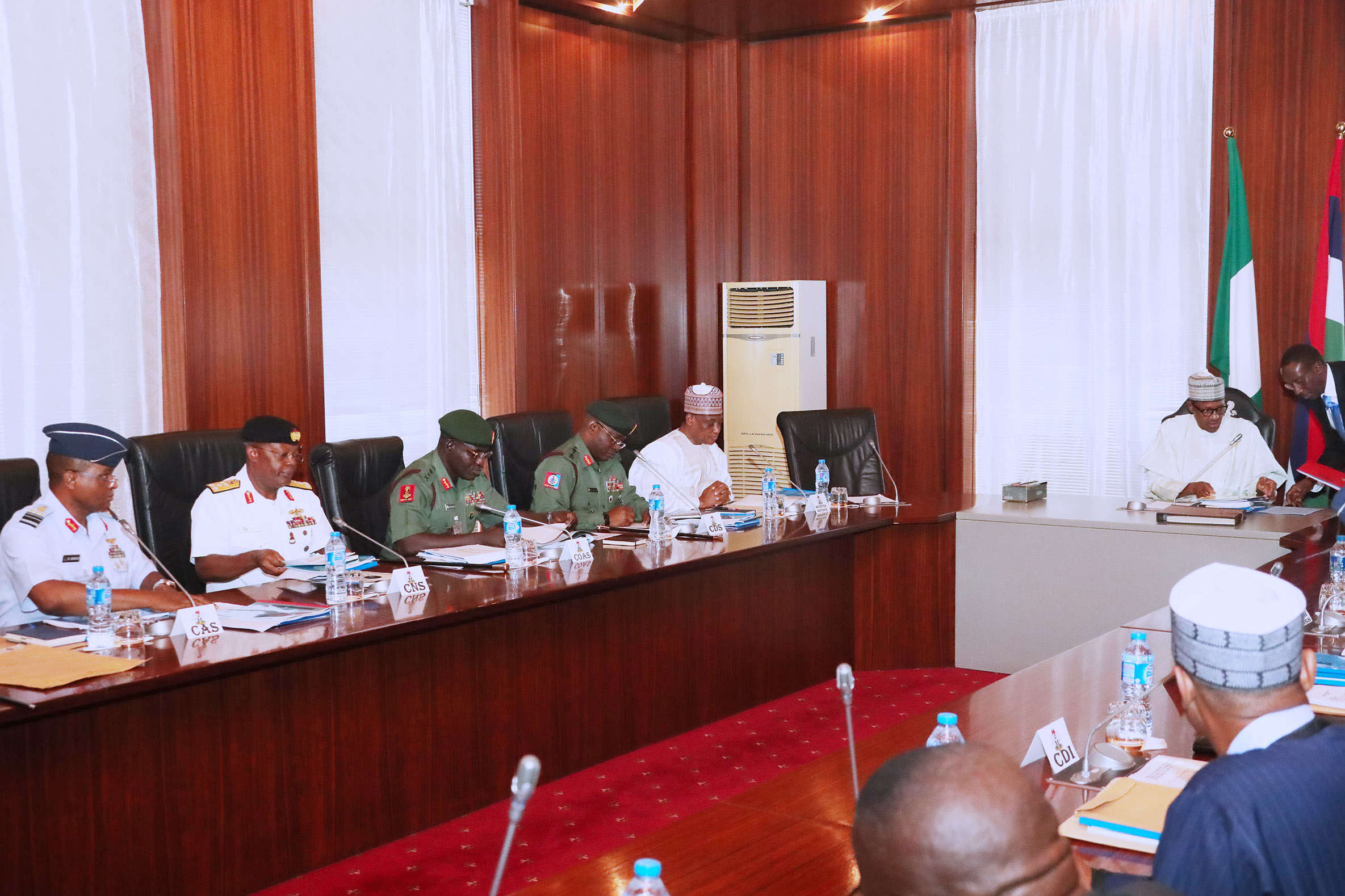 President Muhammadu Buhari meets service chiefs and heads of security agencies at the State House in Abuja.
