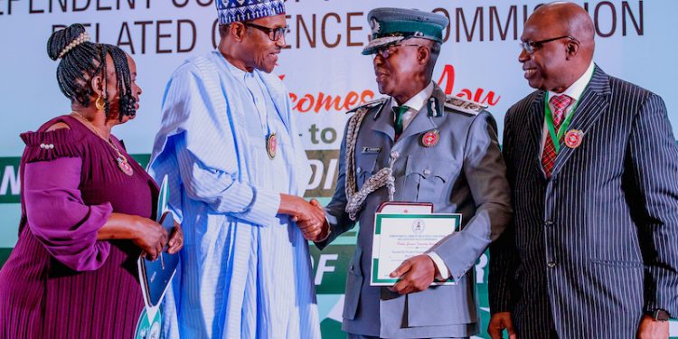 Buhari honours Customs officer for rejecting N150m bribe from drug traffickers, woman who found, retuned $12m