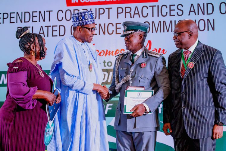 Buhari honours Customs officer for rejecting N150m bribe from drug traffickers, woman who found, retuned $12m