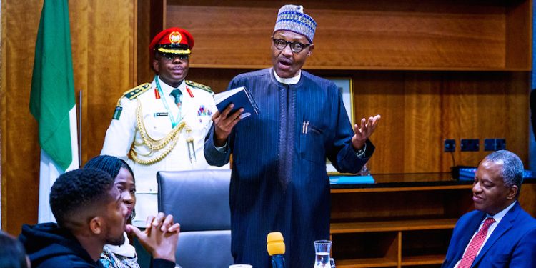 PHOTOS: Anthony Joshua presents belts to Buhari, prostrates