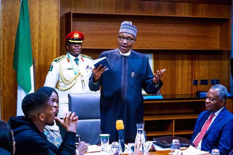 PHOTOS: Anthony Joshua presents belts to Buhari, prostrates