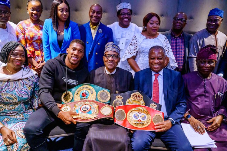 PHOTOS: Anthony Joshua presents belts to Buhari, prostrates