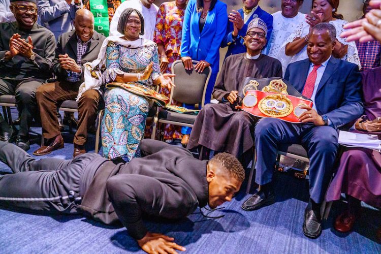 PHOTOS: Anthony Joshua presents belts to Buhari, prostrates