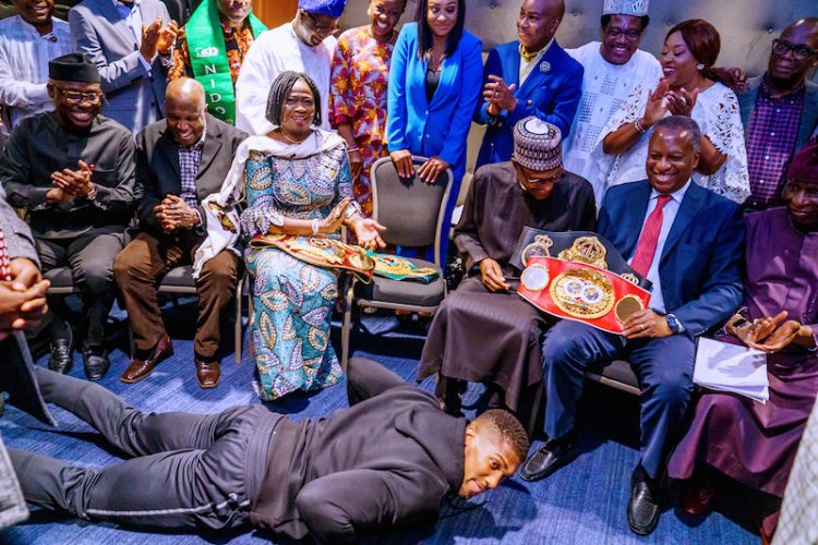 PHOTOS: Anthony Joshua presents belts to Buhari, prostrates