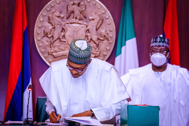 President Buhari signs reviewed 2020 Appropriation Bill, at the State House, on Friday